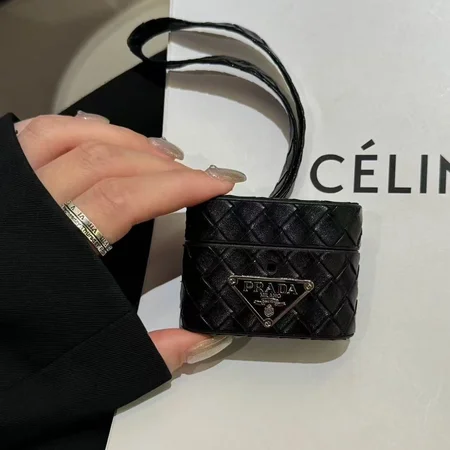 Prada - inspired barrel - shaped woven - pattern AirPods case with hand strap
