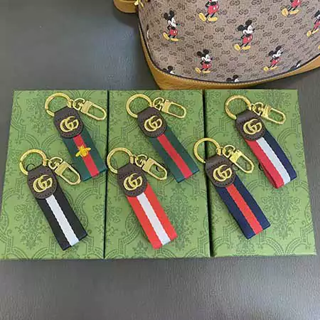 Gucci striped gold - logo hook keychain
