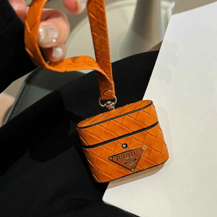 Prada - inspired barrel - shaped woven - pattern AirPods case with hand strap