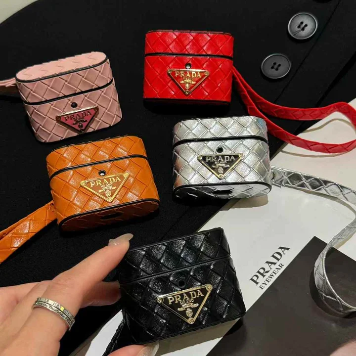 Prada - inspired barrel - shaped woven - pattern AirPods case with hand strap