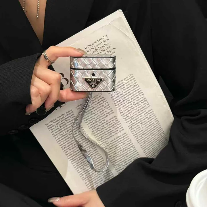 Prada - inspired barrel - shaped woven - pattern AirPods case with hand strap